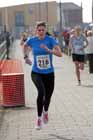 Lucy Wallace finishing the womens Transped Blyth Valley 10k.